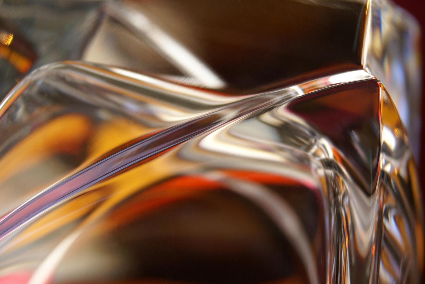 Specular 1, a picture showing an abstract reflection made with a glass like dsurface with orange and brown shades